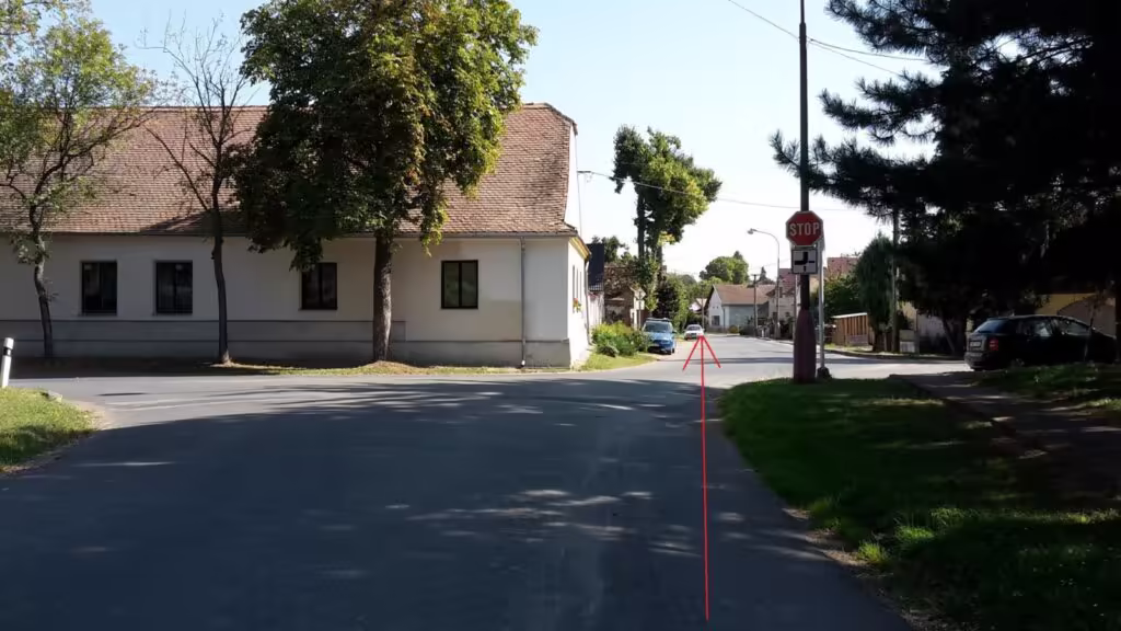 Zatáčka u bílého domu na trase